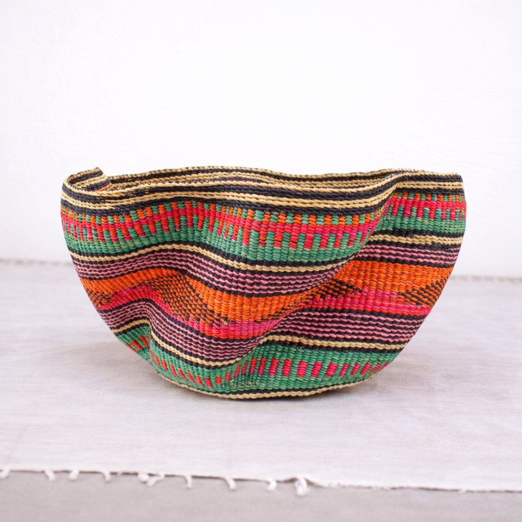 Wide woven bowl with bright multicoloured stripes